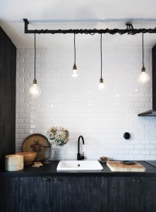 skona hem kitchen subway tile plank covered cabinets light bulb pendants lights textile cords wrapped around pole cococozy